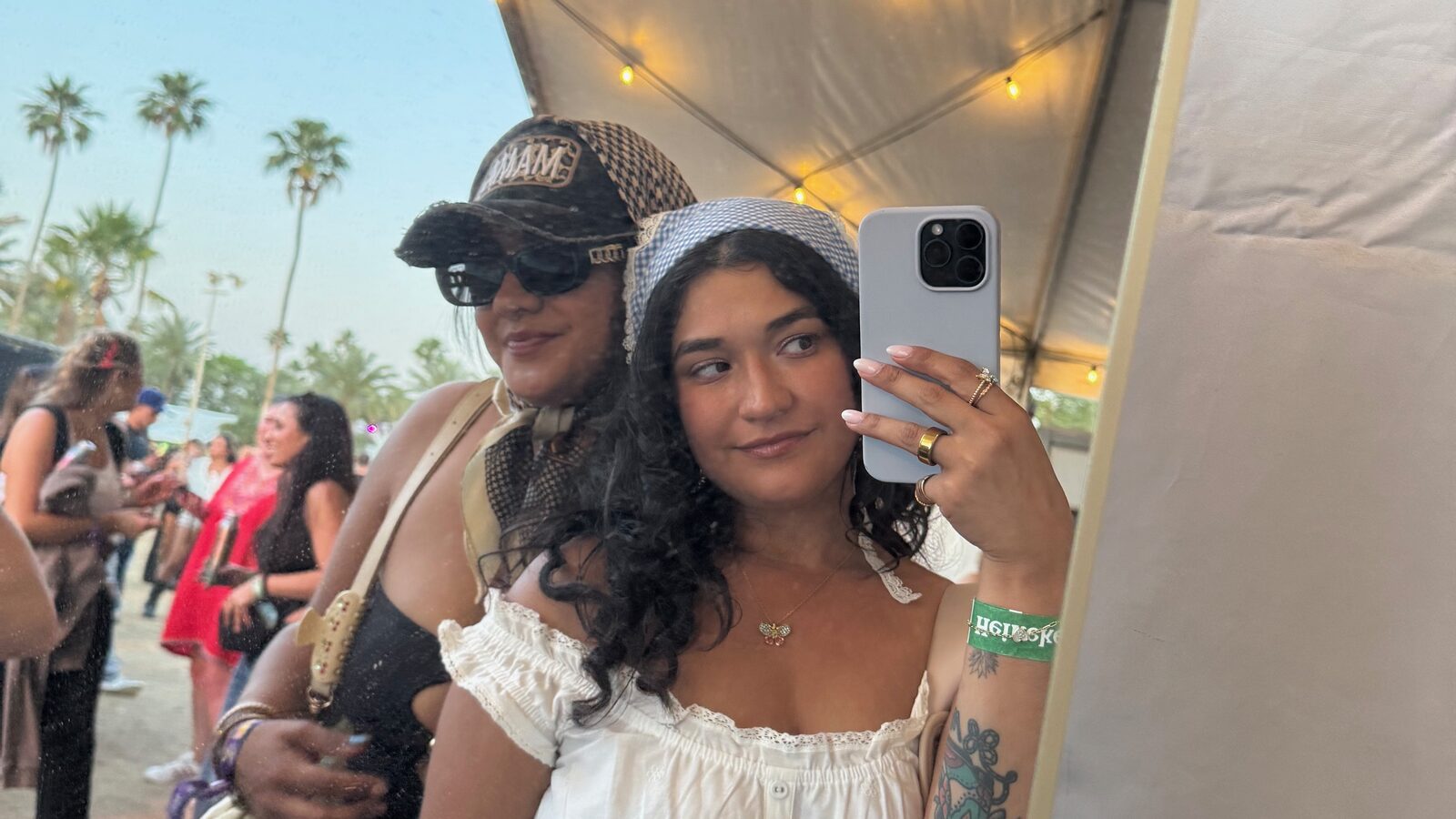 Janet and her friend smiling, ready for a day at Coachella