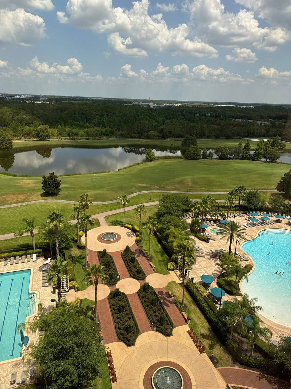 Aerial view of the pools, gardens, and golf course at Rosen Shingle Creek resort in Orlando